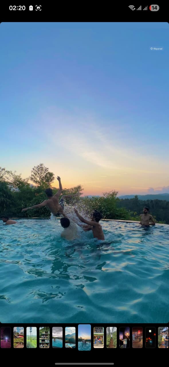 Friends enjoying the infinity pool at sunset
